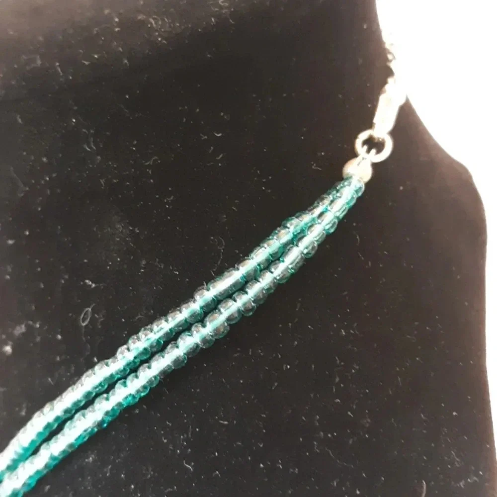 2 strand shell like turquoise necklace.